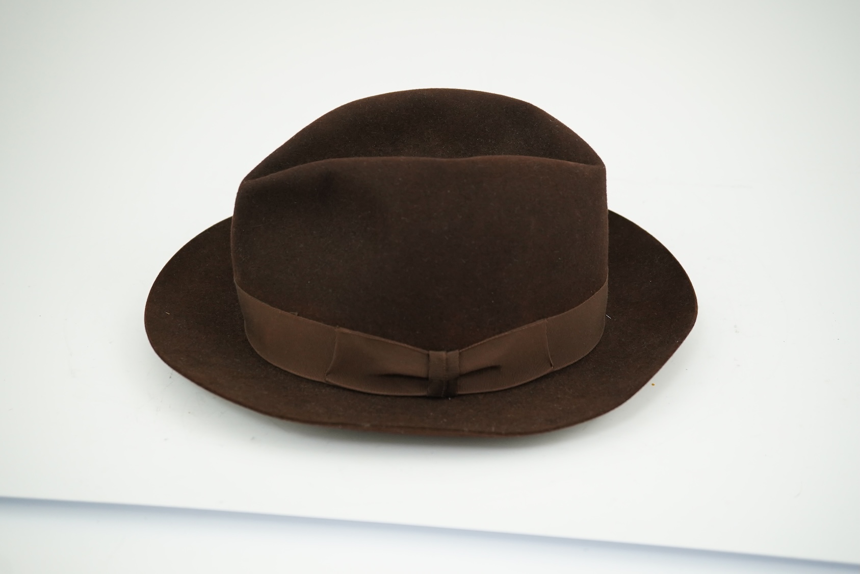 A brown felt Dunn and Co hat Size 56